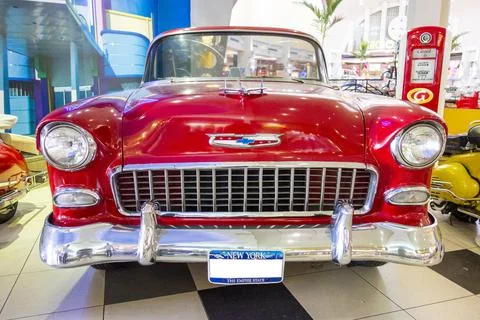 Horizontal front image of an old restored red convertible Chevrolet car Stock Photos