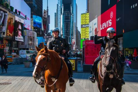Horizontal front view of two mounted New York City policemen in Times Square Stock Photos