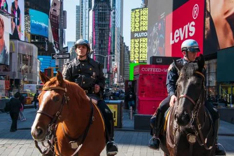 Horizontal front view of two mounted New York City policemen in Times Square Stock Photos