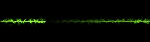 Horizontal green plasma electrical discharge energy bolt on black backgroun.. Видео 334900339