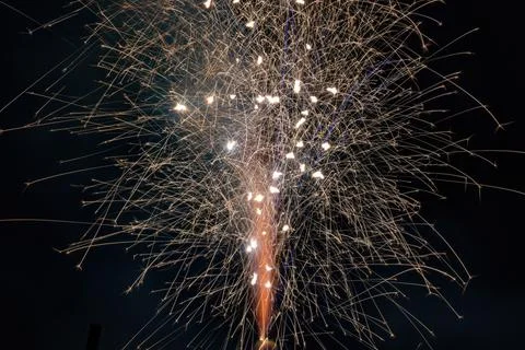Horizontal of ground firework shooting bright sparks 스톡 사진