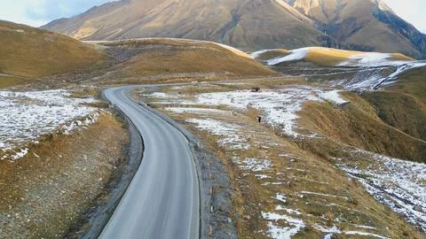 Horizontal high angle view of an empty curved highway stretching through ro.. Stock Photos