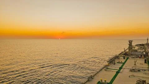 Horizontal high angle view of a golden sunset over the calm ocean taken fro.. Stock-Fotos
