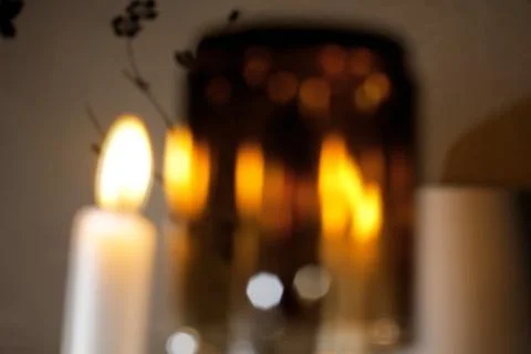 Horizontal image of abstract bokeh light in a night unfocused candles. Stock Photos