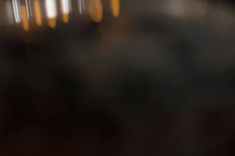 Horizontal image of abstract bokeh light in a night unfocused candles. Stock Photos