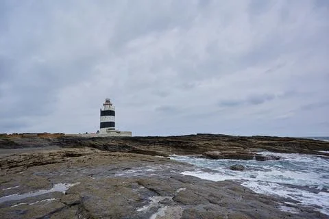 Horizontal image of hook lighthouse with cloudy sky. cloudscape of Wexford, I Stock Photos