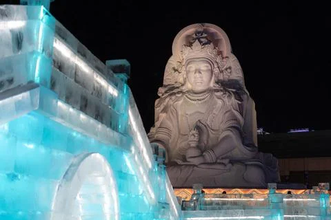 Horizontal image of spectacular illuminated white ice sculptures in Harbin,.. Stock Photos