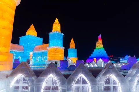 Horizontal image of spectacular illuminated white ice sculptures in Harbin,.. Stock Photos
