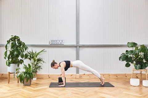 Horizontal image with a yoga instructor doing pose and a large copy space for Stock Photos