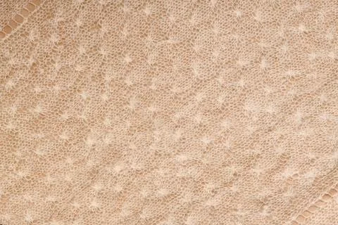 Horizontal knitted light background with diagonal stripes at the corners. Stock Photos