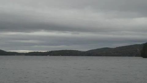 Horizontal layers of grey clouds over peaceful waters Stock Footage 165251788