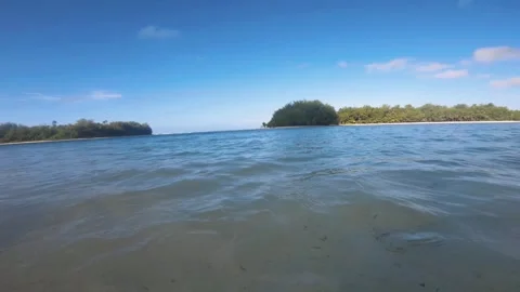 Horizontal look out pane view from Oneroa to Koromiri to Taakoka islet from muri Stock Footage 252178430