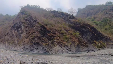 Horizontal look up view to mountains creek valley canyon hills with tree and bro Stock-Footage 265494491