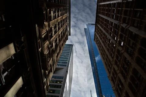 A horizontal low angle shot of reflective high-rise buildings under the breat Fotos de archivo