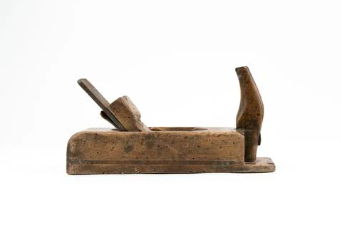 Horizontal low angle studio shot of small vintage wood planer isolated on white Stock Photos