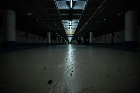 Horizontal low angle view of an empty underground parking Stock Photos