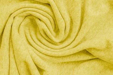 Horizontal macro close up of a soft bright yellow knitted fabric material t.. Stock Photos