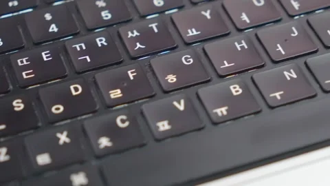 Horizontal Macro Pan Left to Right Over Korean Laptop Keyboard Video stock 338368456