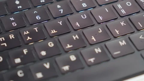Horizontal Macro Pan Right to Left Over Korean Laptop Keyboard Video stock 338368493
