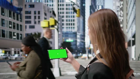 Horizontal mockup screen on mobile phone held by a gen z young girl Stock Footage 325682586