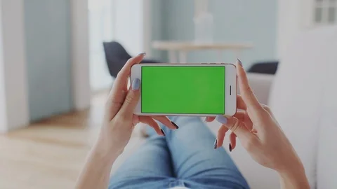 Horizontal mode of Mobile Cellphone. Green Screen or Mock-up Tracking Display on Stock Footage 122414897