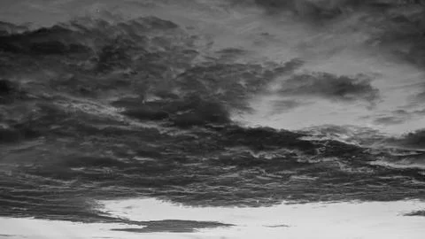 A horizontal monochrome perspective captures layers of dramatic dark heavy .. Stock Photos