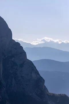 Horizontal mountain ranges and vertical slope of Punta Euringer mountain. Fog Stock Photos