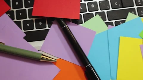 Horizontal movement of adhesive colored papers on laptop Video stock 293049153