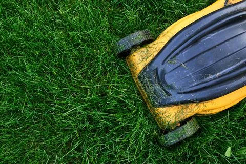 Horizontal mower deck and blade housing in grass Stock Photos