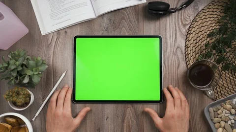 Horizontal orientation tab with green screen. Hand tap on center then wait. Stock Footage 129392514
