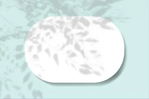 A horizontal oval sheet of white paper on the blue wall background. Mockup Illustrazione stock