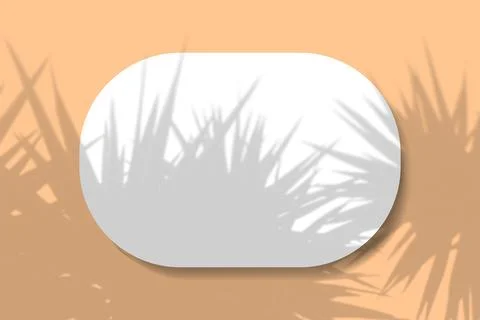 A horizontal oval sheet of white textured paper on the orange wall background Illustrazione stock