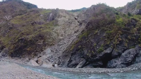 Horizontal over look to river water surged rapidly with speed raced downstream t Stock Footage 265492099