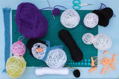 A horizontal overhead view of some craft snowmen and some of the tools needed Foto stock
