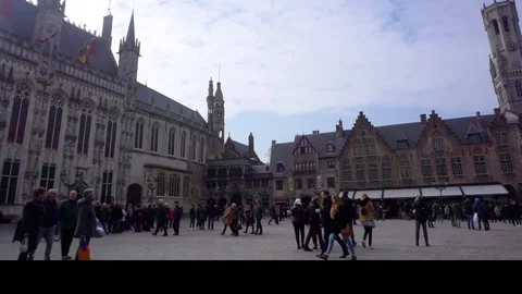 Horizontal pan of crowded square in old european city. Video stock 88693046
