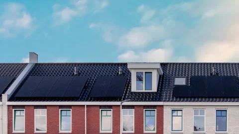 Horizontal pan of new Dutch row houses with solar panels Stock Footage 328642698