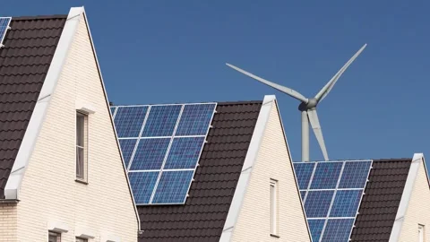 Horizontal pan of newly built Dutch houses with solar panels Stock Footage 265975097