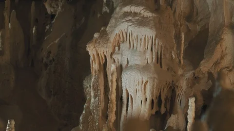 Horizontal pan of a rock formation inside a cave Stock Footage 94957588
