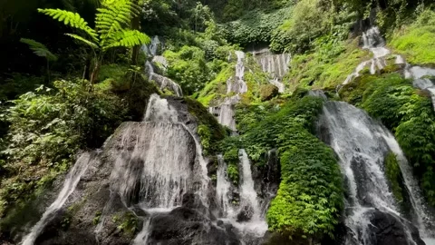 Horizontal Pan Shot of Multi Tiered Cascade Waterfall in Bali Stock Footage 340562219
