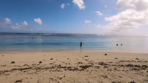 Horizontal pane look out view of blue turquoise calm relax lagoon with sandy bea Stock Footage 245447733