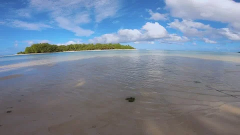 Horizontal pane view of beach sandy side look out to Koromiriand Taakoka islets  Stock Footage 253461173