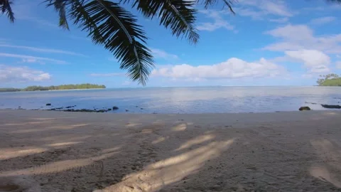 Horizontal pane view at beach sandy side look out to calm relax turquoise ocean  Stock Footage 253461907