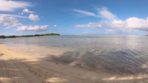 Horizontal pane view at beach sandy side look out to calm relax turquoise ocean  Stock Footage 253462532