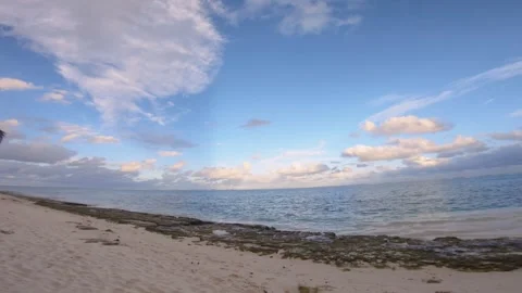 Horizontal pane view of beach sandy side look out to pacific horizon and calm re Stock Footage 258441672