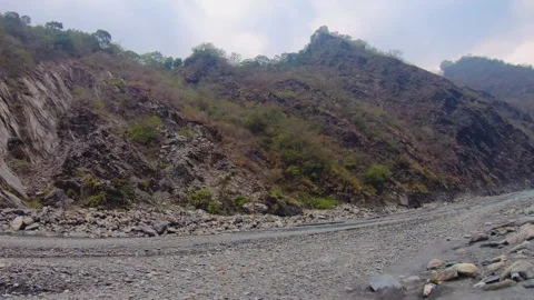 Horizontal pane view from hills to slow motion of group of hikers wearing profes Stock Footage 266501752