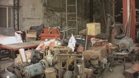 Horizontal pane view of interior of a factory storage house shade of bunch junky Stock Footage 237251972