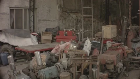 Horizontal pane view of interior of a factory storage house shade of bunch junky Video stock 237251973