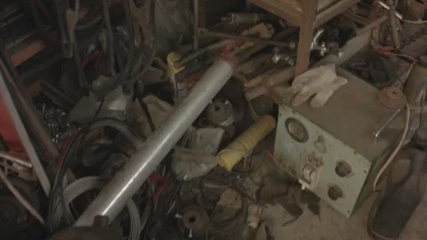 Horizontal pane view of interior of a factory storage house shade of bunch junky Stock Footage 237252175