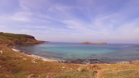 Horizontal pane view of look out to Manashanyu from sandy beach side and dry bus Stock Footage 240483290