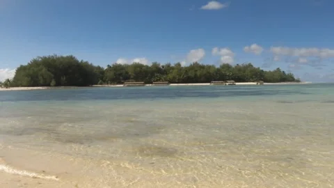 Horizontal pane view look out to Taakoka and Koromiri islets during good weather Stock Footage 245442700